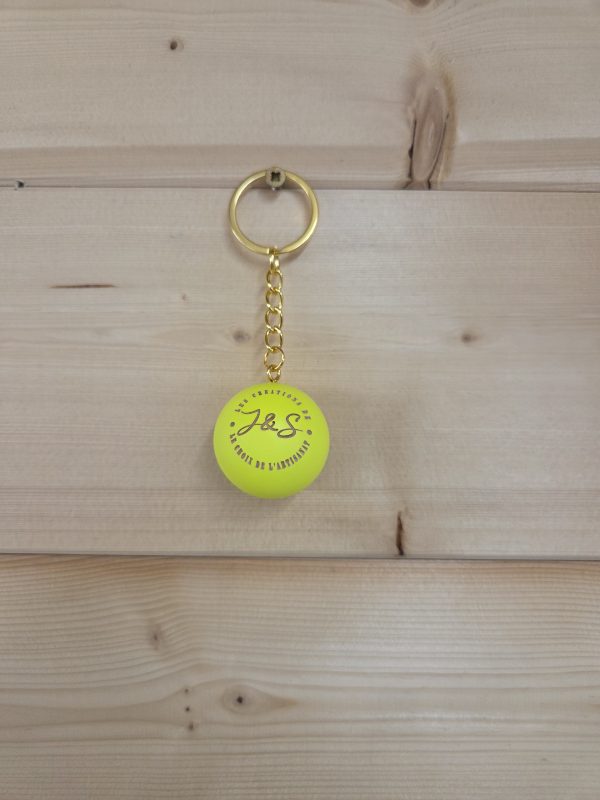 Porte-clés cochonnet personnalisé de couleur jaune fluo avec logo