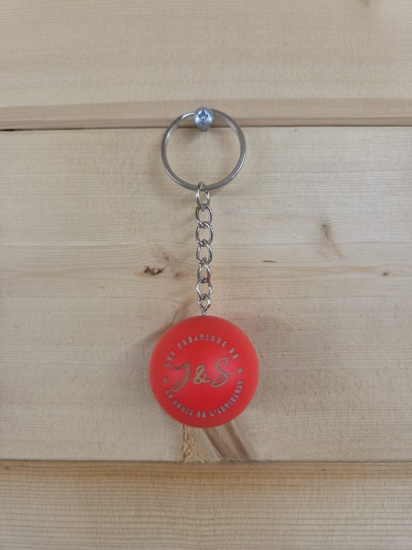 Porte-clés cochonnet personnalisé de couleur rouge fluo avec logo
