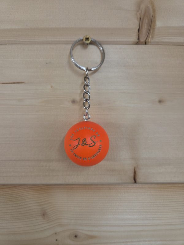 Porte-clés cochonnet personnalisé de couleur orange fluo avec logo
