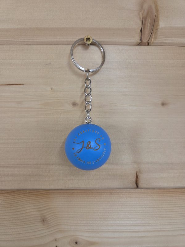 Porte-clés cochonnet personnalisé de couleur bleu fluo avec gravure